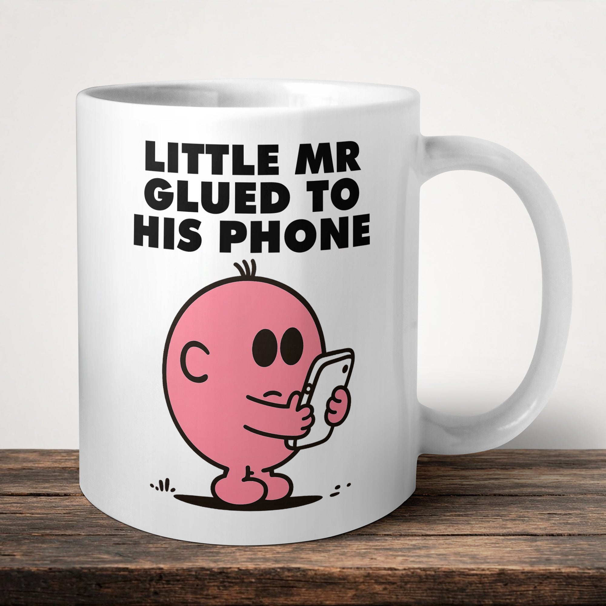 Little Mr Glued To His Phone Mug front view - printed product by Perrys Prints